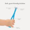imageFrida Baby TripleAngle Toothhugger Training Toddler Toothbrush  Toddler Toothbrush 2 Years and Up Cleans All Sides at Once  2 Pack Yellow  PinkBlue